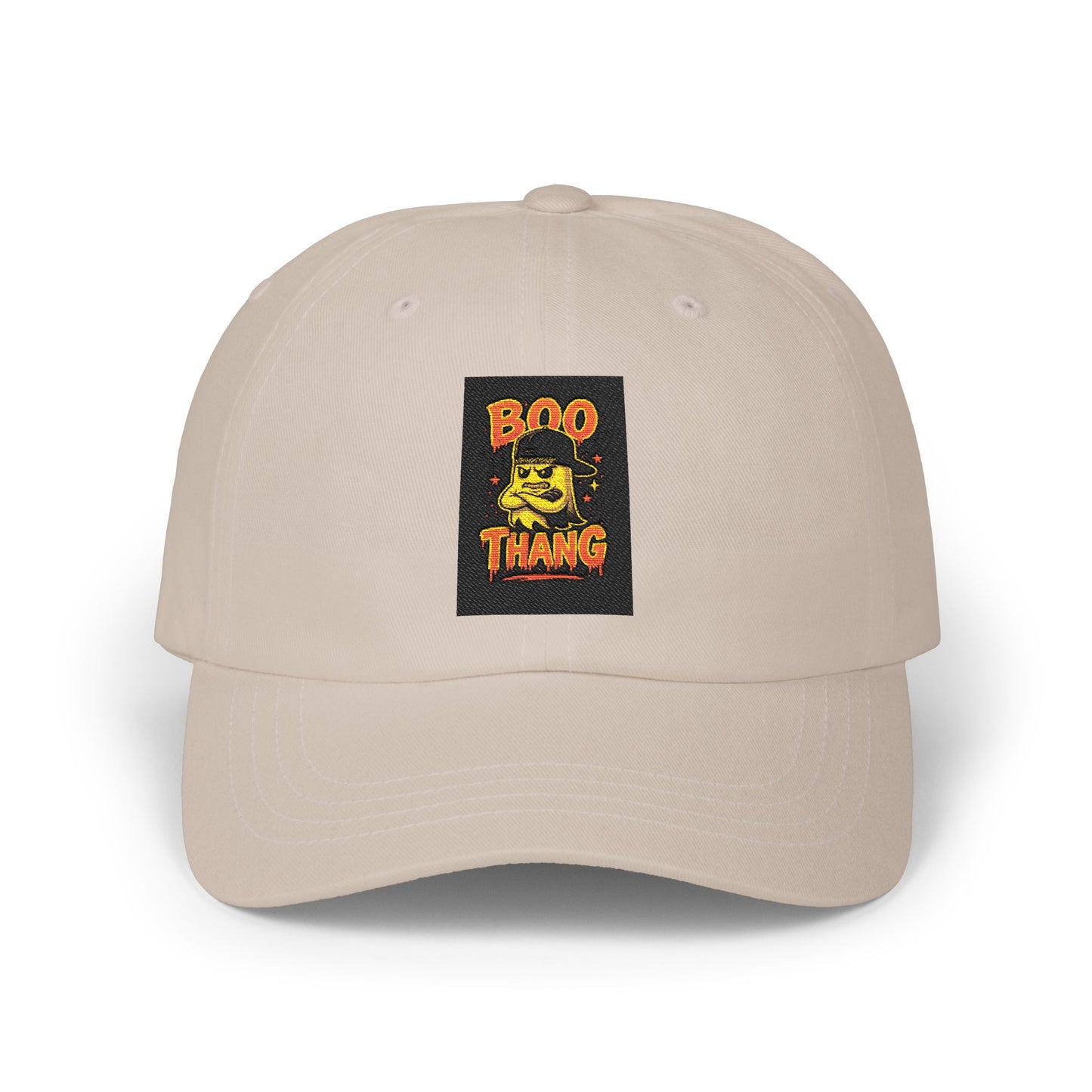 Beige cap with a graphic patch featuring text and a face design on a white background