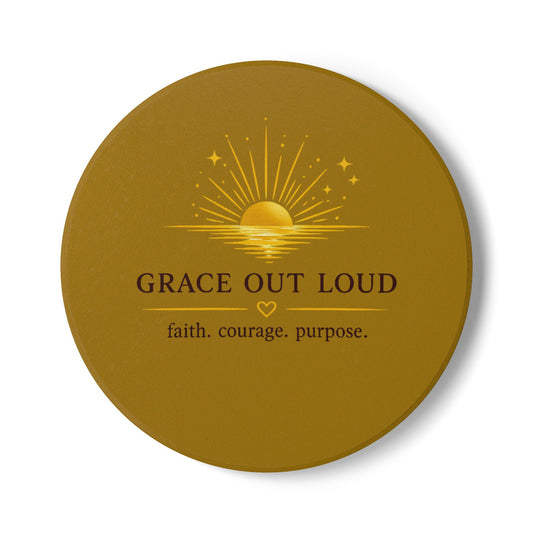 "Grace Out Loud ceramic coaster with inspirational sunrise faith quote — warm cream and gold tones"