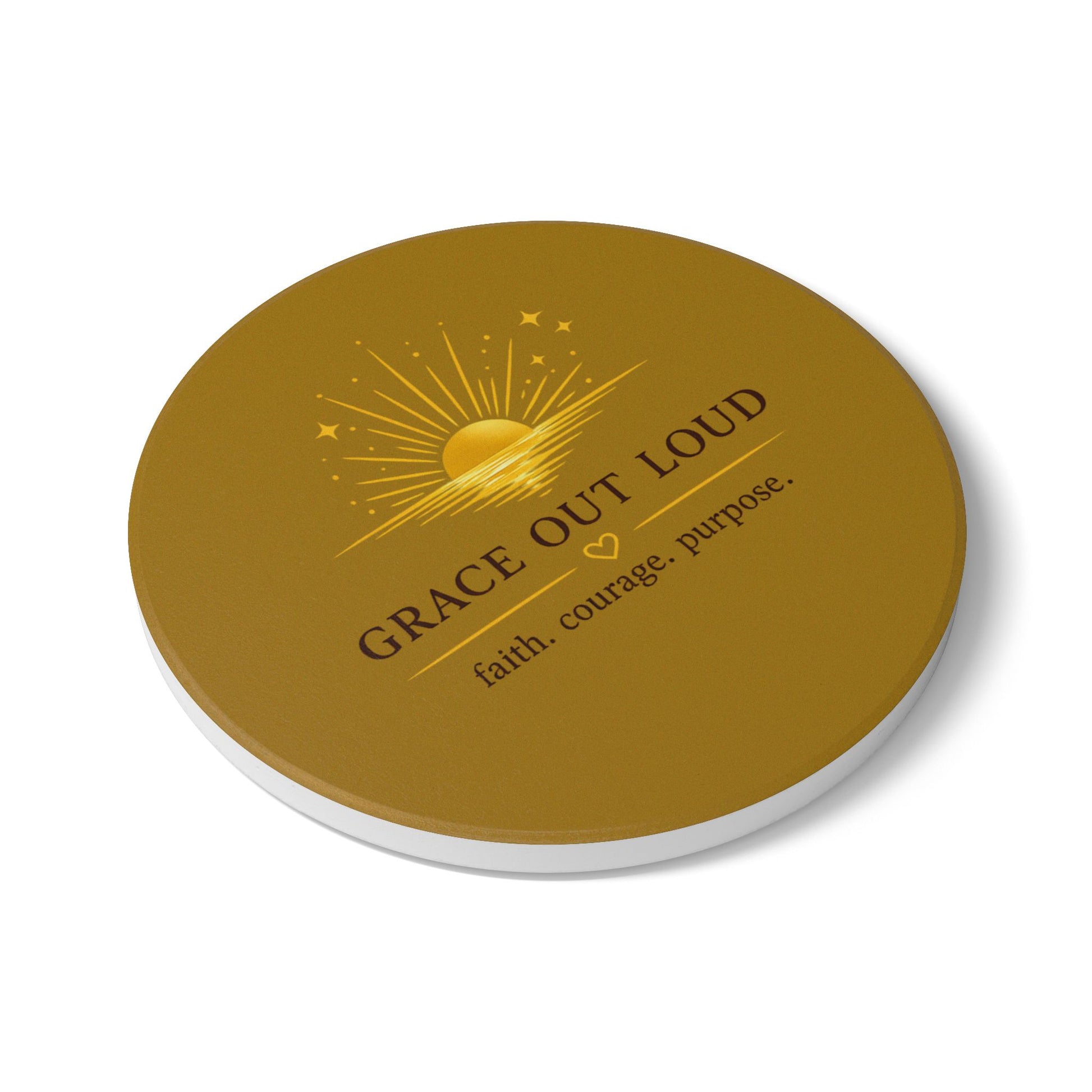 "Grace Out Loud ceramic coaster with inspirational sunrise faith quote — warm cream and gold tones" slanted view