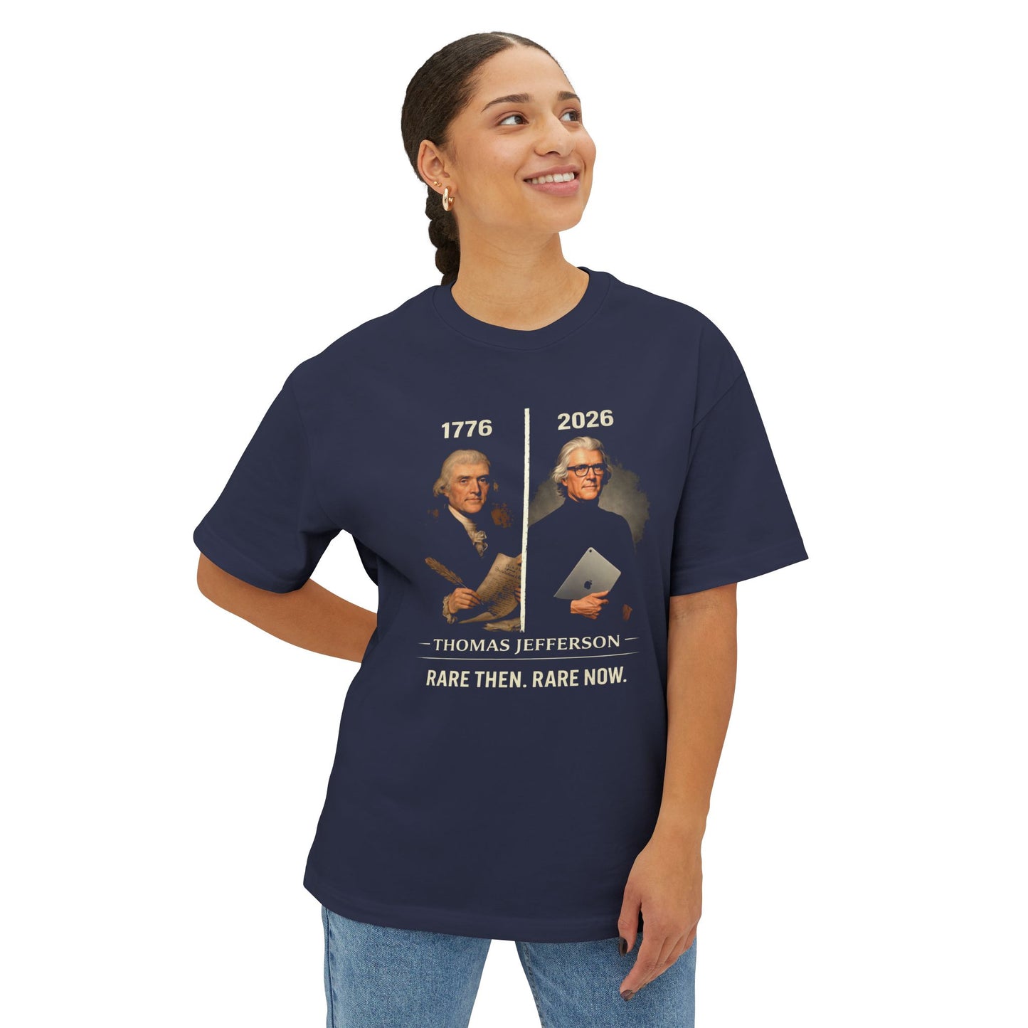 woman wearing a navy blue t-shirt with a graphic and text, standing against a white background