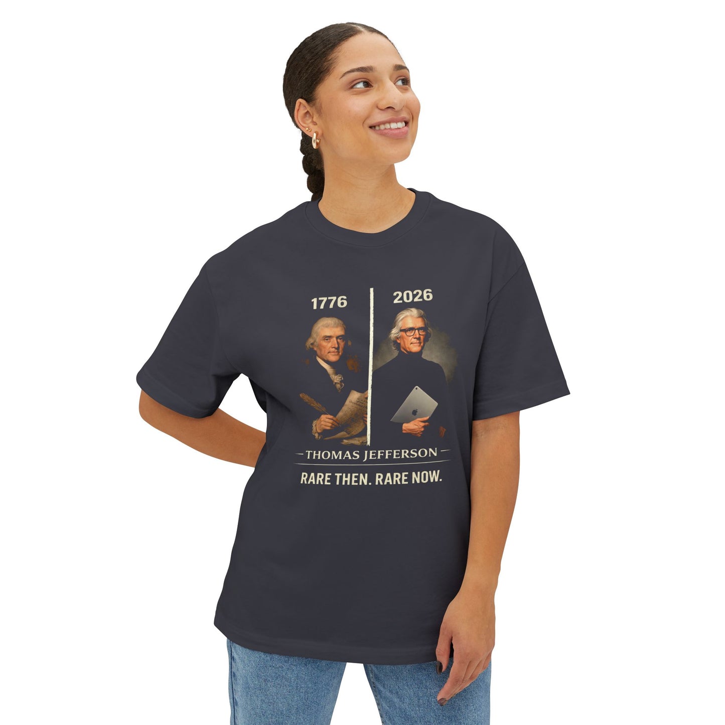Woman wearing a Gray t-shirt with a graphic and text, standing against a white background