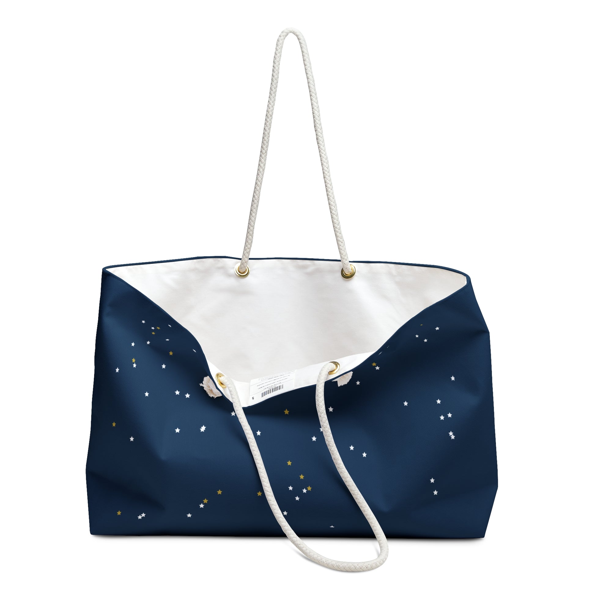 "Navy Land of the Free weekender bag with scattered star constellation pattern and cream rope handles" inside view