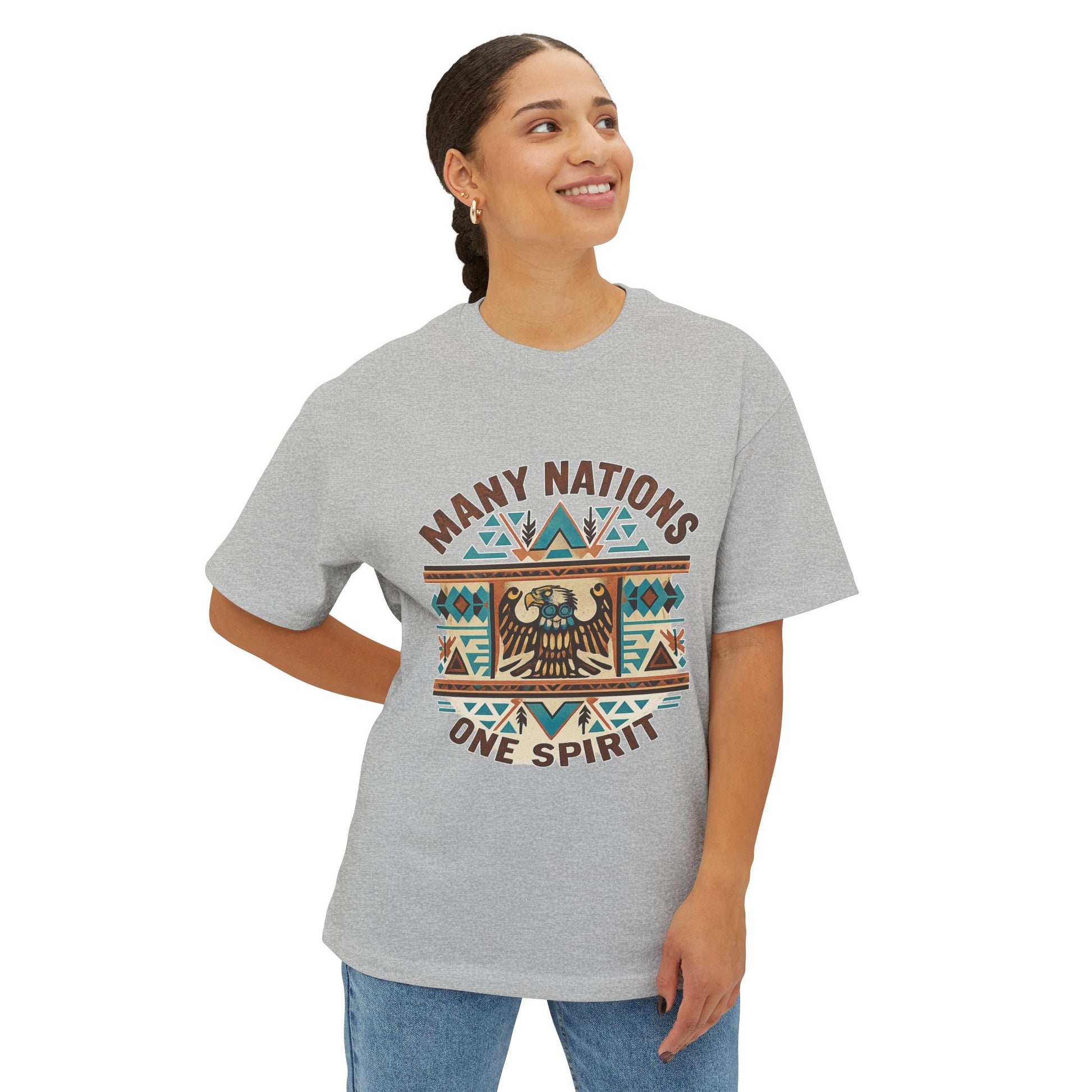 Model wearing a gray t-shirt with 'Many Nations One Spirit' design on a white background