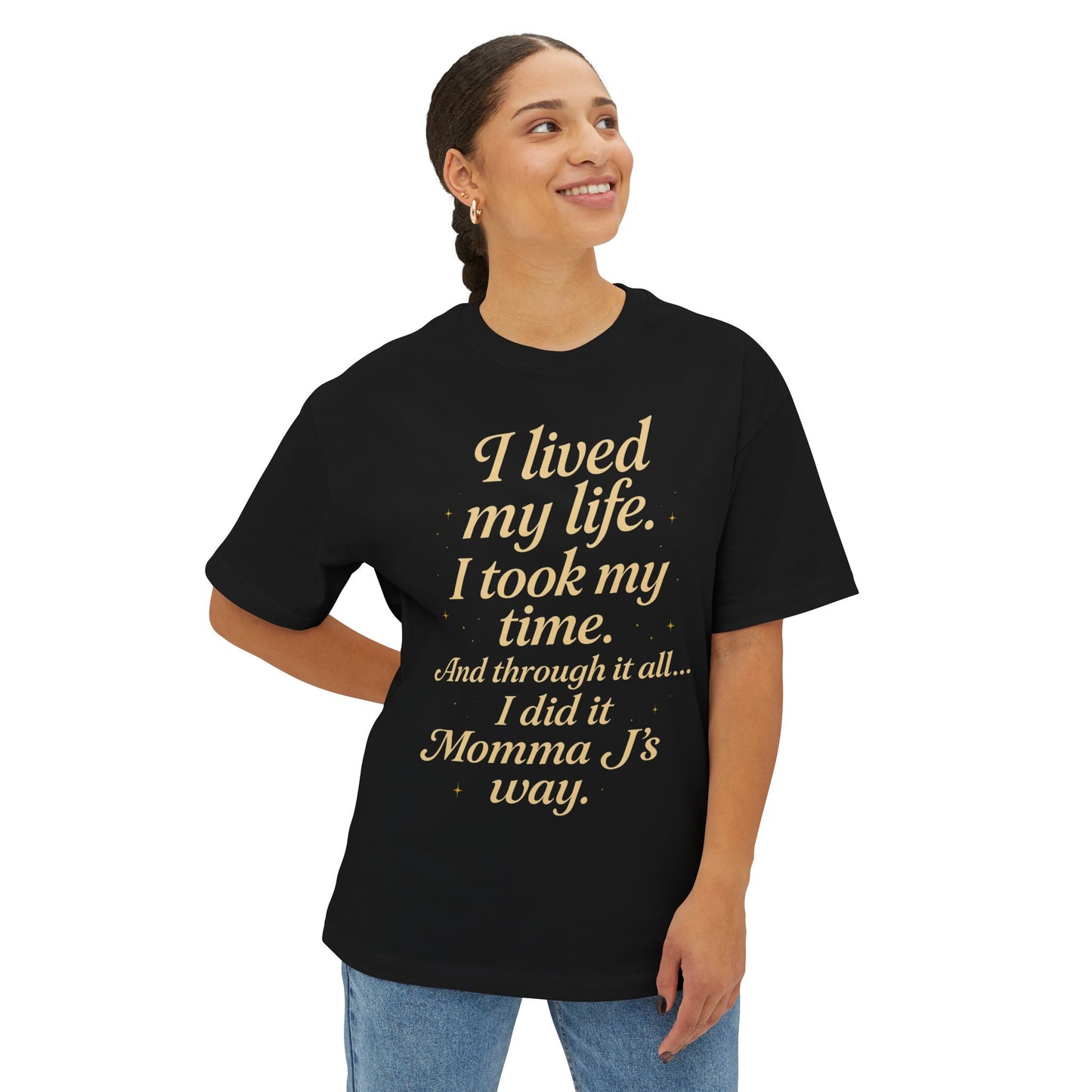 Person wearing a black t-shirt with gold text on a white background