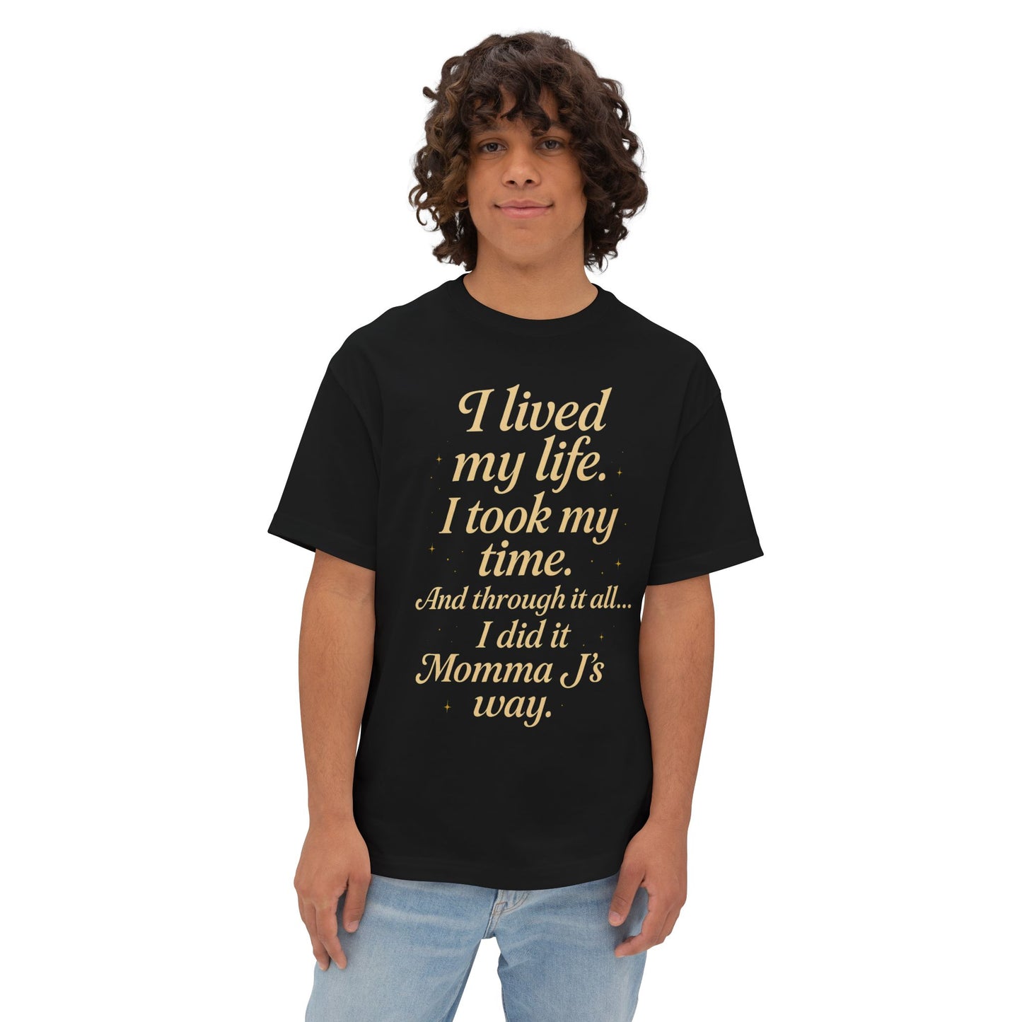Person wearing a black t-shirt with gold text on a white background