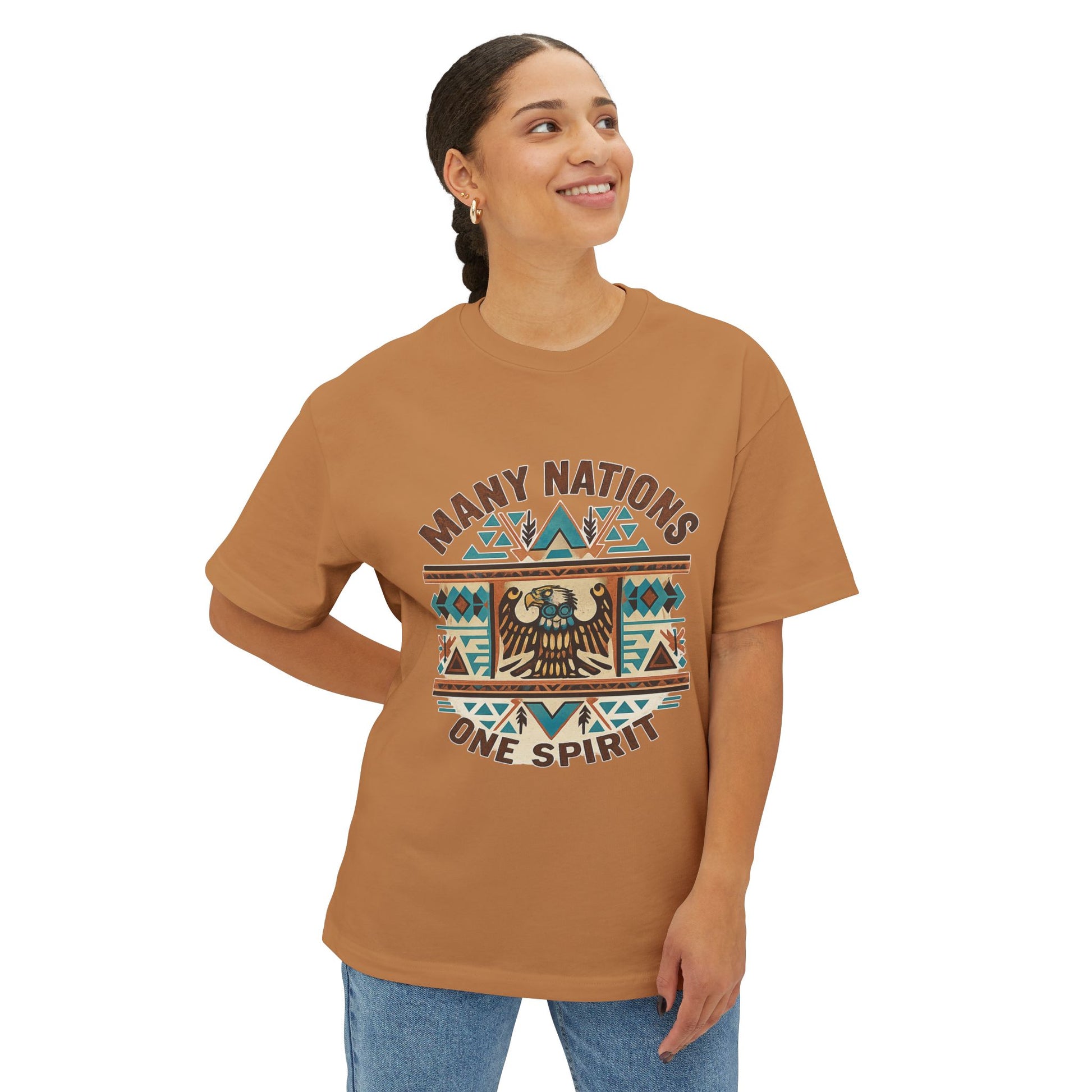 Model wearing a brown t-shirt with 'Many Nations One Spirit' design on a white background